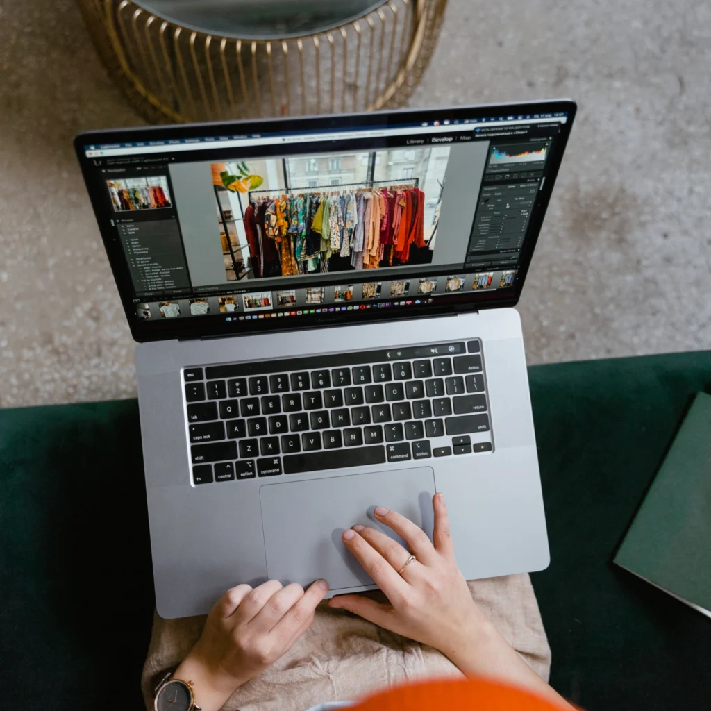 Choosing clothes pictures on her laptop